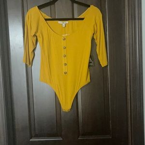 NWT Express mustard color bodysuit. Size Medium.